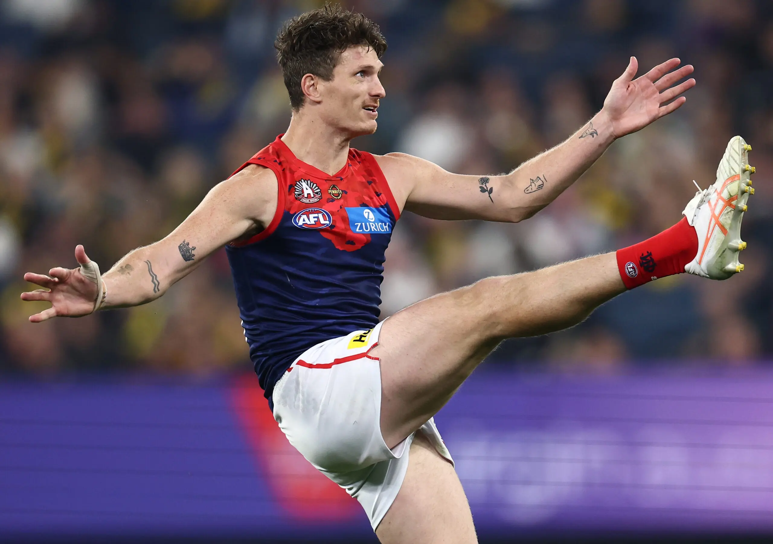 MELBOURNE, AUSTRALIA - APRIL 24: Brody Mihocek of the Demons kicks a goal during the 2026 AFL Round 07 match between the Richmond Tigers and the Melbourne Demons at the Melbourne Cricket Ground on April 24, 2026 in Melbourne, Australia. (Photo by James Wiltshire/AFL Photos via Getty Images)
