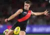 MELBOURNE, AUSTRALIA - MAY 02: Sullivan Robey of the Bombers kicks the ball during the 2026 AFL Round 08 match between the Essendon Bombers and the Brisbane Lions at Marvel Stadium on May 2, 2026 in Melbourne, Australia. (Photo by James Wiltshire/AFL Photos via Getty Images)
