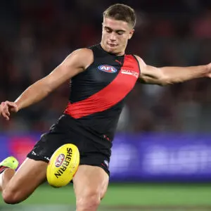 MELBOURNE, AUSTRALIA - MAY 02: Sullivan Robey of the Bombers kicks the ball during the 2026 AFL Round 08 match between the Essendon Bombers and the Brisbane Lions at Marvel Stadium on May 2, 2026 in Melbourne, Australia. (Photo by James Wiltshire/AFL Photos via Getty Images)