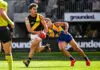 PERTH, AUSTRALIA - MAY 02: Jayden Short of the Tigers is tackled by Elijah Hewett of the Eagles during the 2026 AFL Round 08 match between the West Coast Eagles and the Richmond Tigers at Optus Stadium on May 2, 2026 in Perth, Australia. (Photo by Daniel Carson/AFL Photos via Getty Images)