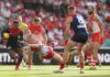 SYDNEY, AUSTRALIA - MAY 03: Kysaiah Pickett of the Demons evades a tackled by Chad Warner of the Swans during the round eight AFL match between Sydney Swans and Melbourne Demons at Sydney Cricket Ground, on May 03, 2026, in Sydney, Australia. (Photo by Darrian Traynor/Getty Images)