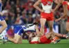 MELBOURNE, AUSTRALIA - MAY 09: Jacob Konstanty of the Kangaroos and Tom Papley of the Swans wrestle during the 2026 AFL Round 09 match between the North Melbourne Kangaroos and the Sydney Swans at Marvel Stadium on May 9, 2026 in Melbourne, Australia. (Photo by James Wiltshire/AFL Photos via Getty Images)