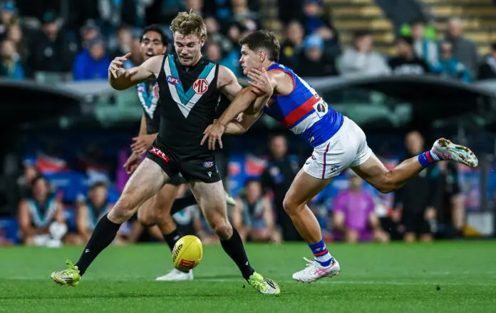 ADELAIDE, AUSTRALIA - MAY 08: Mitch Georgiades of the Power 
 caught by w19during the round nine AFL match between Port Adelaide Power and Western Bulldogs at Adelaide Oval, on May 08, 2026, in Adelaide, Australia. (Photo by Mark Brake/Getty Images)