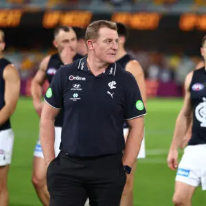 BRISBANE, AUSTRALIA - MAY 08: Michael Voss, Senior Coach of the Blues and the team leave the field after the round nine AFL match between Brisbane Lions and Carlton Blues at The Gabba, on May 08, 2026, in Brisbane, Australia. (Photo by Chris Hyde/AFL Photos/via Getty Images)
