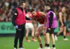 MELBOURNE, AUSTRALIA - MAY 22: Archer May of the Bombers is helped from the ground by trainers during the round 11 AFL match between Richmond Tigers and Essendon Bombers at Melbourne Cricket Ground, on May 22, 2026, in Melbourne, Australia. (Photo by Quinn Rooney/Getty Images)