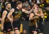 MELBOURNE, AUSTRALIA - MAY 22: Tom Lynch of the Tigers is congratulated by team mates after kicking a goal during the round 11 AFL match between Richmond Tigers and Essendon Bombers at Melbourne Cricket Ground, on May 22, 2026, in Melbourne, Australia. (Photo by Quinn Rooney/Getty Images)