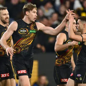 MELBOURNE, AUSTRALIA - MAY 22: Tom Lynch of the Tigers is congratulated by team mates after kicking a goal during the round 11 AFL match between Richmond Tigers and Essendon Bombers at Melbourne Cricket Ground, on May 22, 2026, in Melbourne, Australia. (Photo by Quinn Rooney/Getty Images)