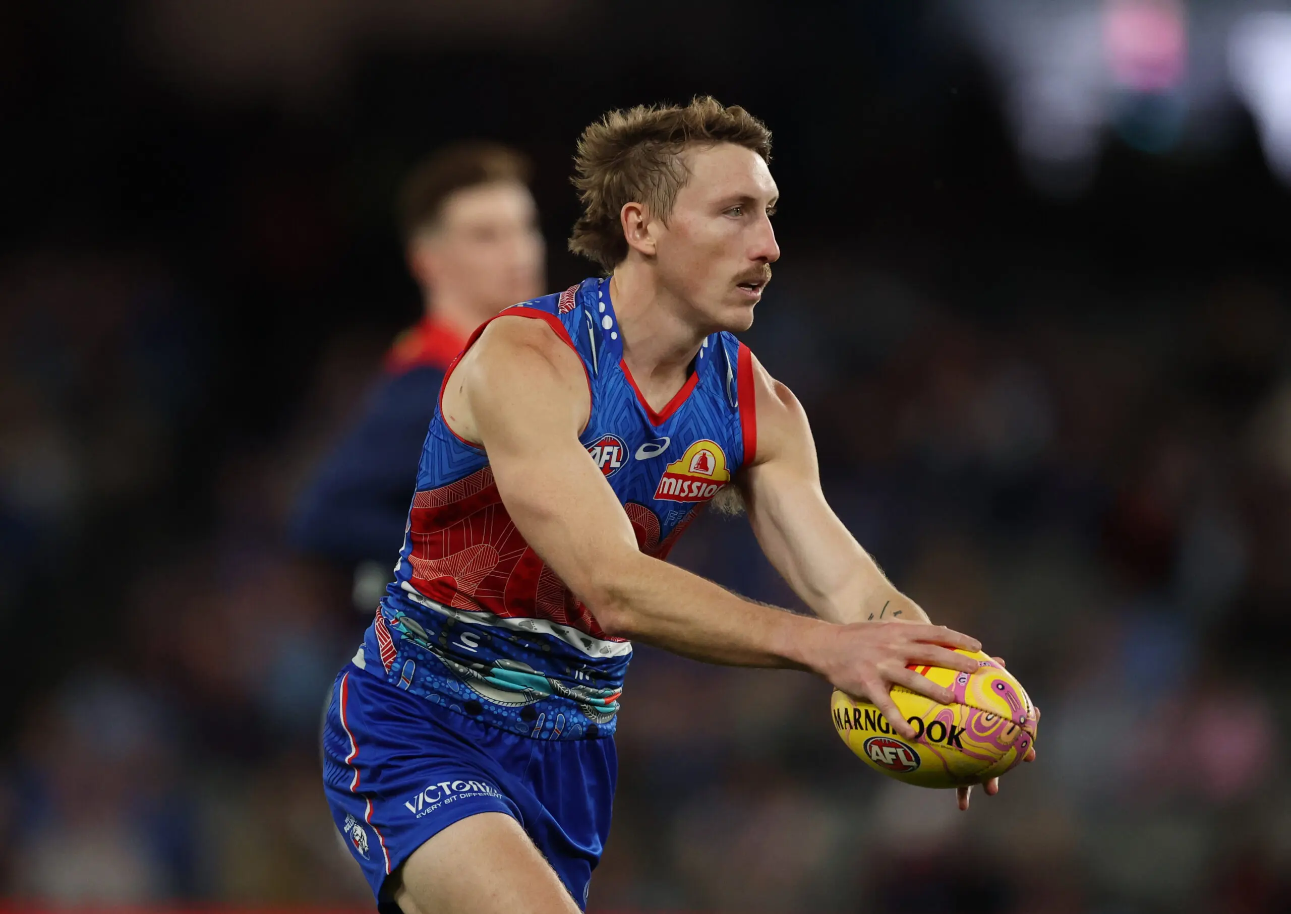 MELBOURNE, AUSTRALIA - MAY 24: Bailey Dale of the Bulldogs runs with the ball during the round 11 AFL match between Western Bulldogs and Narrm (Melbourne Demons) at Marvel Stadium, on May 24, 2026, in Melbourne, Australia. (Photo by Robert Cianflone/Getty Images)