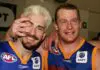 MELBOURNE, AUSTRALIA - SEPTEMBER 18:  Jason Akermanis #12 and Michael Voss #3 for the Lions celebrate after winning the AFL Second Preliminary Final match between the Brisbane Lions and the Geelong Cats at the Melbourne Cricket Ground September 18 2004 in Melbourne, Australia. (Photo by Mark Dadswell/Getty Images)