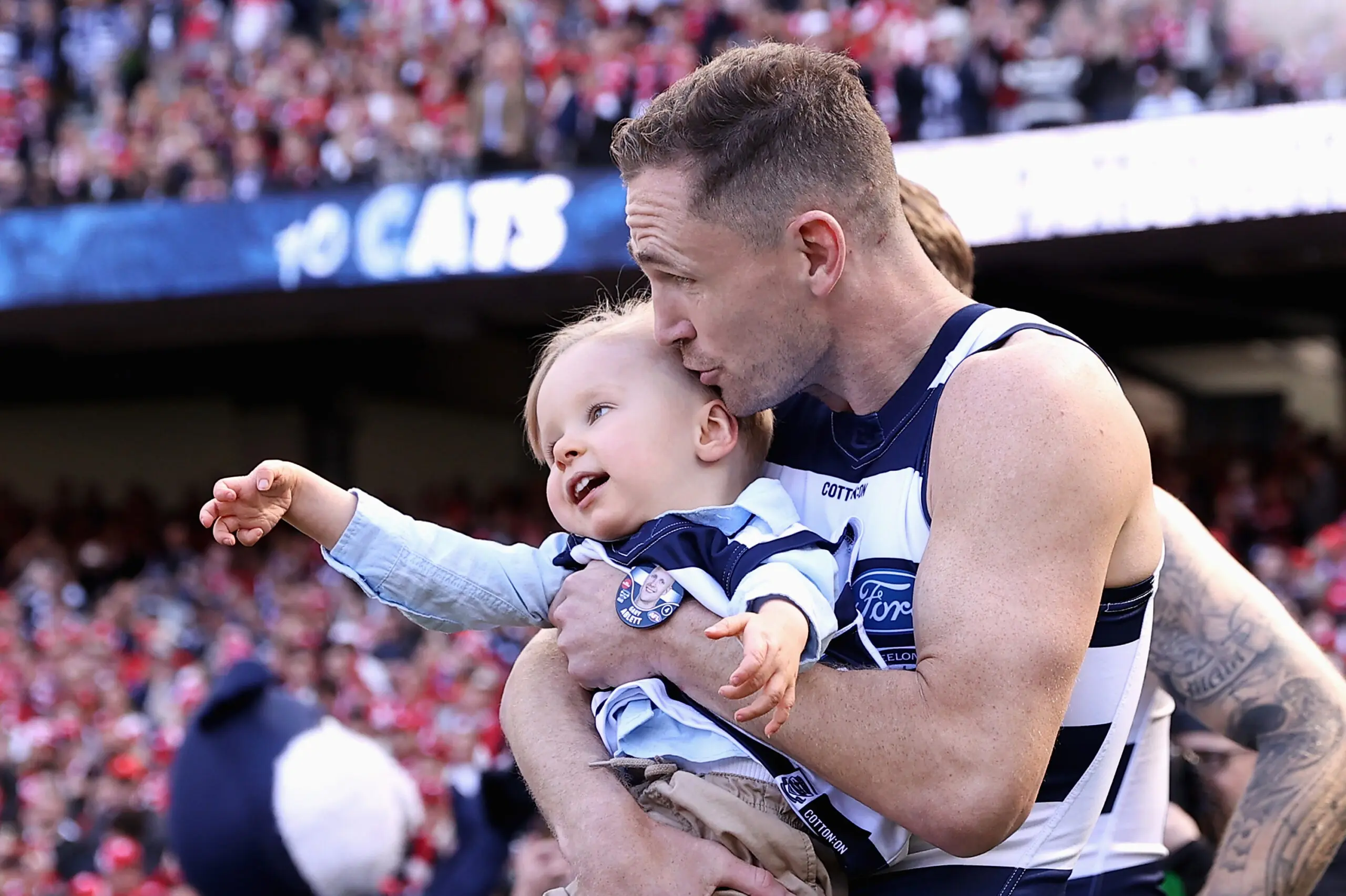 MELBOURNE, AUSTRALIA - SEPTEMBER 24: Joel Selwood of the Cats with Gary Ablett Jr's son Levi Ablett enter the field during the 2022 AFL Grand Final match between the Geelong Cats and the Sydney Swans at the Melbourne Cricket Ground on September 24, 2022 in Melbourne, Australia. (Photo by Cameron Spencer/AFL Photos/via Getty Images)