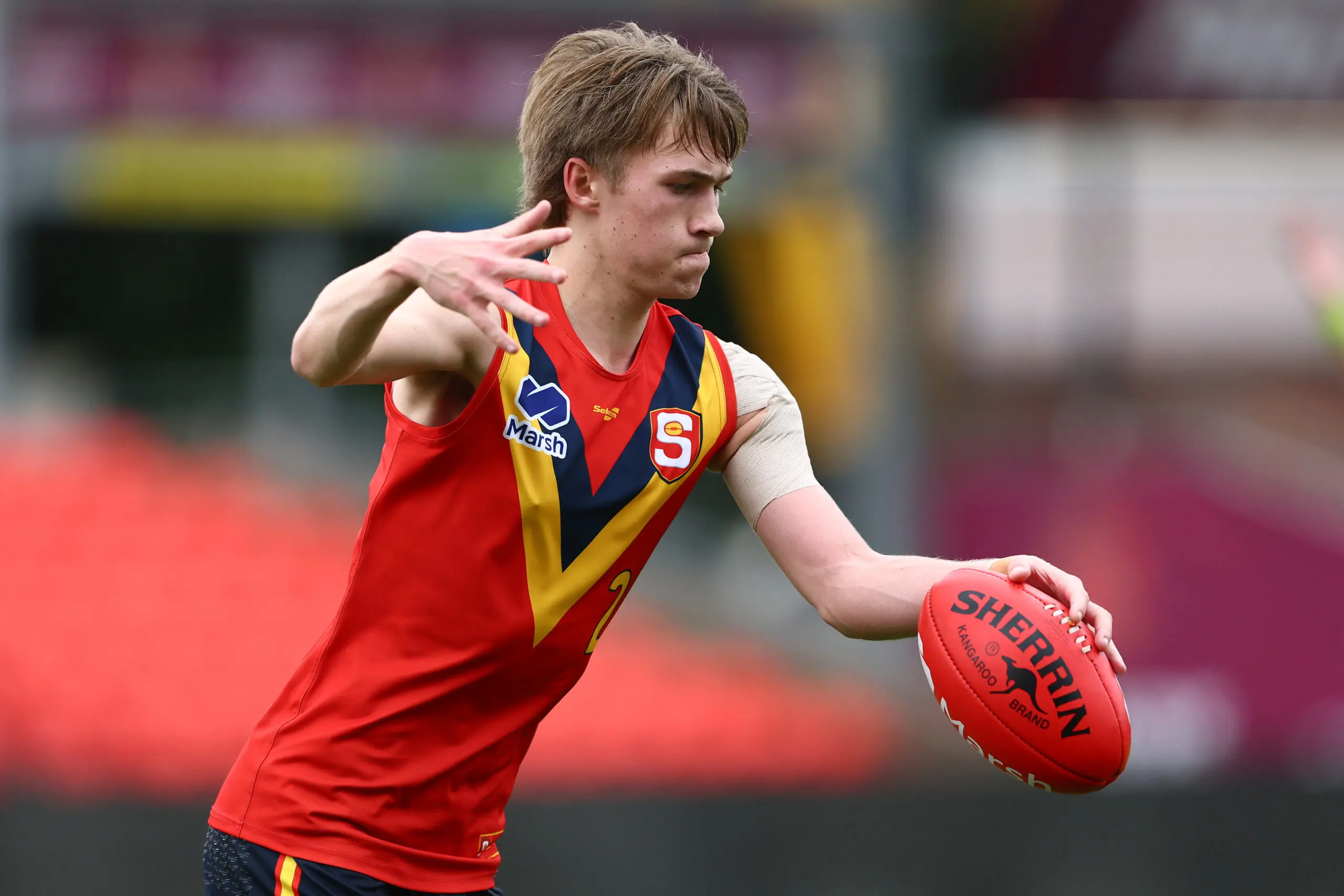 GOLD COAST, AUSTRALIA - JULY 09: Kale Matthews-Hampton of South Australia kicks during the Marsh AFL National Championships match between U16 Boys Victoria Metro and South Australia at People First Stadium on July 09, 2024 in Gold Coast, Australia. (Photo by Chris Hyde/AFL Photos/via Getty Images)