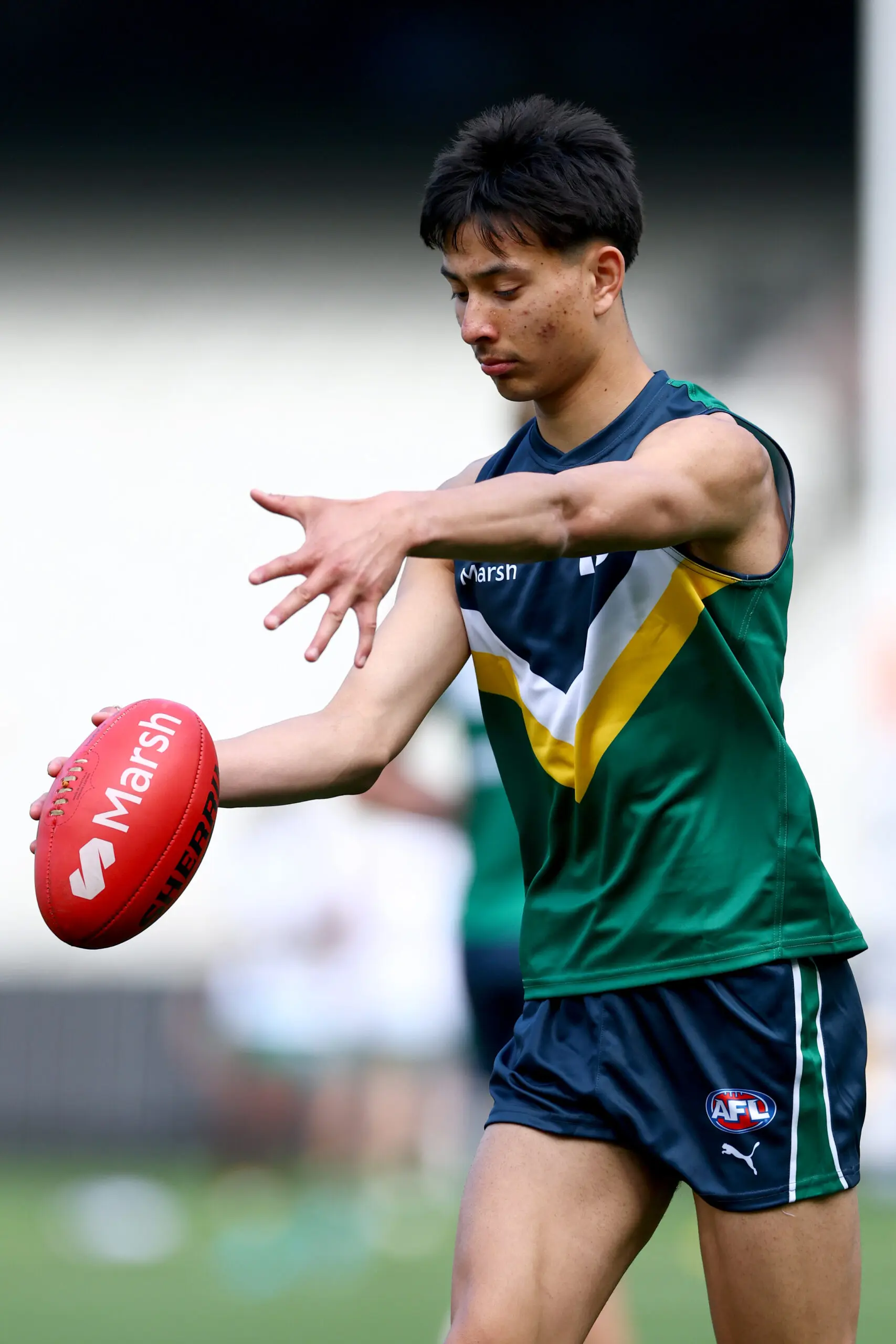 MELBOURNE, AUSTRALIA - SEPTEMBER 27: Blake Justice of Team Docherty warms up ahead of the Marsh AFL National Futures Boys match between Team Boak and Team Docherty at Melbourne Cricket Ground, on September 27, 2025 in Melbourne, Australia. (Photo by Josh Chadwick/AFL Photos/via Getty Images)