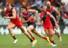 FINAL TEAMS: Melbourne vs Essendon – Round 14, 2026 ADELAIDE, AUSTRALIA - APRIL 11: Caleb Windsor of the Demons clears the ball from the centre during the round five AFL match between Essendon Bombers and Melbourne Demons at Adelaide Oval, on April 11, 2026, in Adelaide, Australia. (Photo by Quinn Rooney/Getty Images)