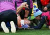 MELBOURNE, AUSTRALIA - JUNE 08: Brody Mihocek of the Demons is assisted by medical staff after being injured during the 2026 AFL Round 13 match between the Collingwood Magpies and the Melbourne Demons at the Melbourne Cricket Ground on June 8, 2026 in Melbourne, Australia. (Photo by Craig Dooley/AFL Photos via Getty Images)