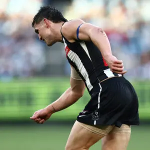 MELBOURNE, AUSTRALIA - JUNE 08: Brayden Maynard of the Magpies runs off with an injured shoulder during the 2026 AFL Round 13 match between the Collingwood Magpies and the Melbourne Demons at the Melbourne Cricket Ground on June 8, 2026 in Melbourne, Australia. (Photo by James Wiltshire/AFL Photos via Getty Images)