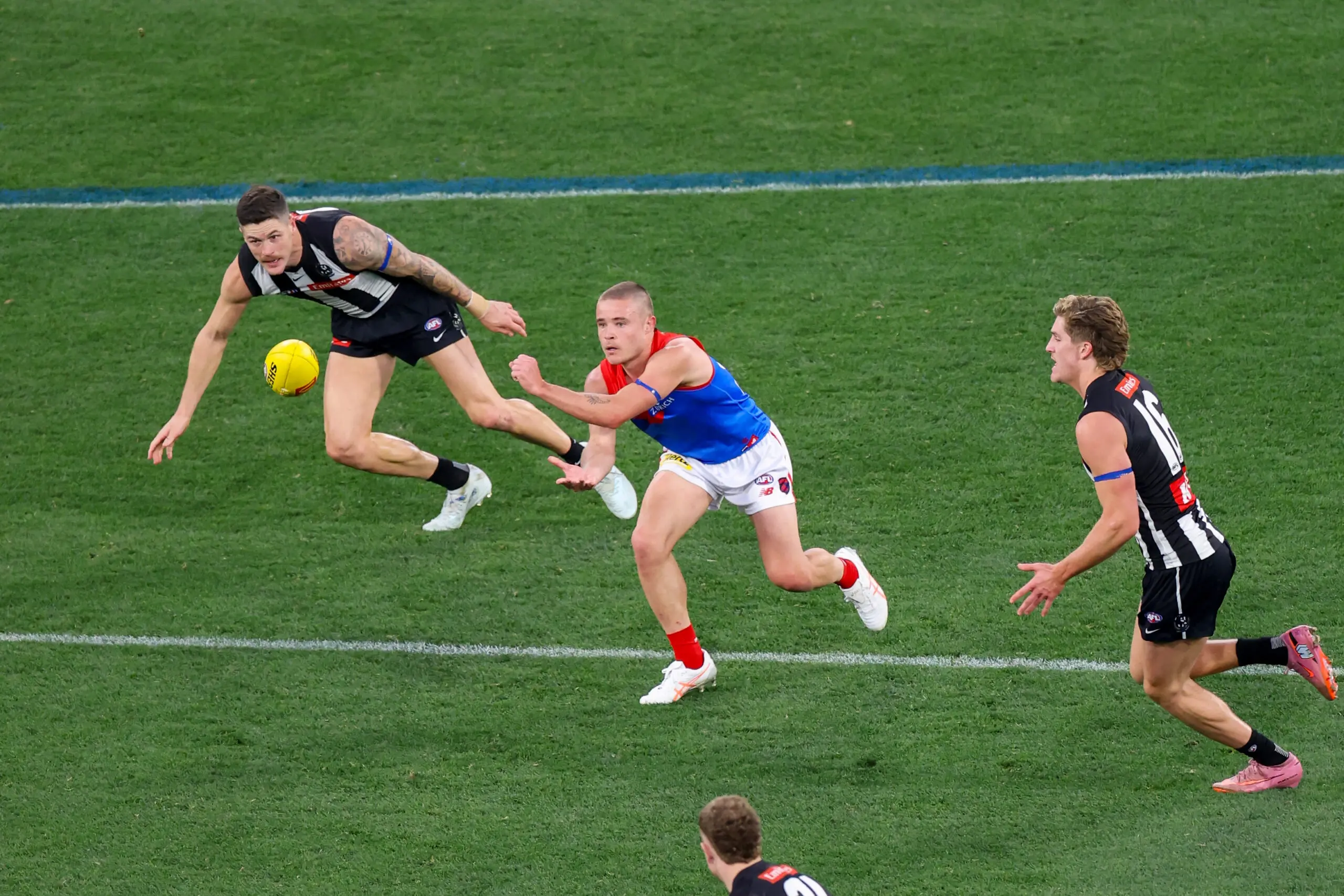 MELBOURNE, AUSTRALIA - JUNE 08: Kade Chandler of the Demons handpasses the ball during the 2026 AFL Round 13 match between the Collingwood Magpies and the Melbourne Demons at the Melbourne Cricket Ground on June 8, 2026 in Melbourne, Australia. (Photo by Craig Dooley/AFL Photos via Getty Images)