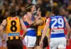 MELBOURNE, AUSTRALIA - JUNE 05: Nick Watson of the Hawks and Michael Sellwood of the Bulldogs wrestle during the round 13 AFL match between Hawthorn Hawks and Western Bulldogs at Melbourne Cricket Ground, on June 05, 2026, in Melbourne, Australia. (Photo by Quinn Rooney/Getty Images)