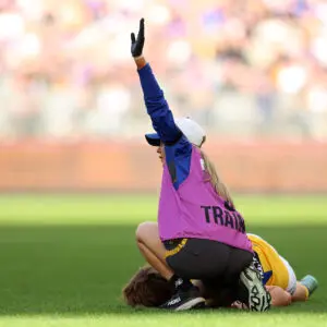PERTH, AUSTRALIA - JUNE 13: Hamish Davis of the Eagles is down with concussion during the round 14 AFL match between North Melbourne Kangaroos and West Coast Eagles at Optus Stadium, on June 13, 2026, in Perth, Australia. (Photo by Janelle St Pierre/AFL Photos/via Getty Images)