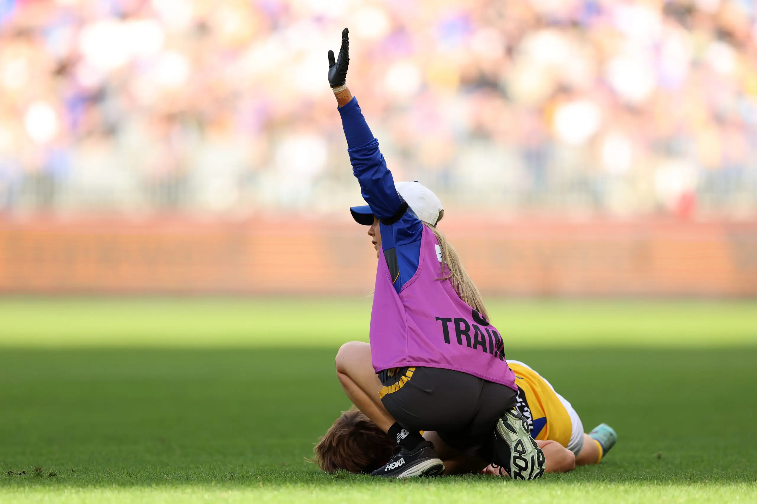 PERTH, AUSTRALIA - JUNE 13: Hamish Davis of the Eagles is down with concussion during the round 14 AFL match between North Melbourne Kangaroos and West Coast Eagles at Optus Stadium, on June 13, 2026, in Perth, Australia. (Photo by Janelle St Pierre/AFL Photos/via Getty Images)