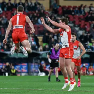 ADELAIDE, AUSTRALIA - JUNE 13: Chad Warner of the Swans celebrates a goal with Angus Sheldrick of the Swans during the round 14 AFL match between Port Adelaide Power and Sydney Swans at Adelaide Oval, on June 13, 2026, in Adelaide, Australia. (Photo by Mark Brake/Getty Images)