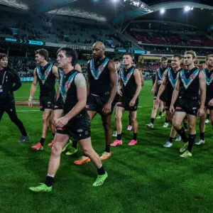 ADELAIDE, AUSTRALIA - JUNE 13: Zak Butters of the Power  leads his team off after the round 14 AFL match between Port Adelaide Power and Sydney Swans at Adelaide Oval, on June 13, 2026, in Adelaide, Australia. (Photo by Mark Brake/Getty Images)