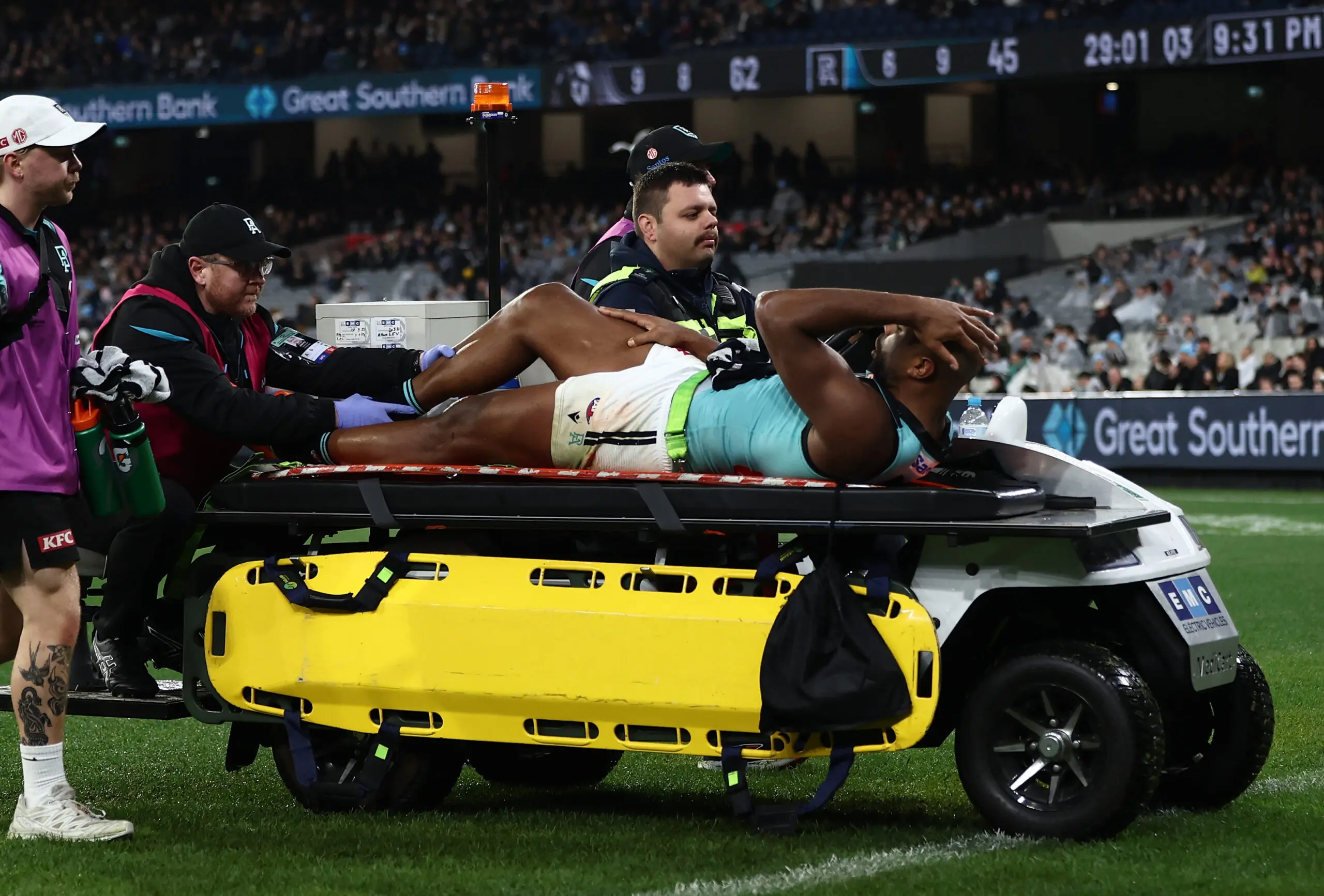 MELBOURNE, AUSTRALIA - JUNE 20: Esava Ratugolea of the Power leaves the ground on the stretcher during the 2026 AFL Round 15 match between the Collingwood Magpies and the Port Adelaide Power at the Melbourne Cricket Ground on June 20, 2026 in Melbourne, Australia. (Photo by James Wiltshire/AFL Photos via Getty Images)