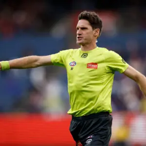 MELBOURNE, AUSTRALIA - MARCH 16: Matt Stevic, AFL Field Umpire in action in his 500th game during the 2025 AFL Round 01 match between the Melbourne Demons and the GWS Giants at the Melbourne Cricket Ground on March 16, 2025 in Melbourne, Australia. (Photo by Dylan Burns/AFL Photos via Getty Images)