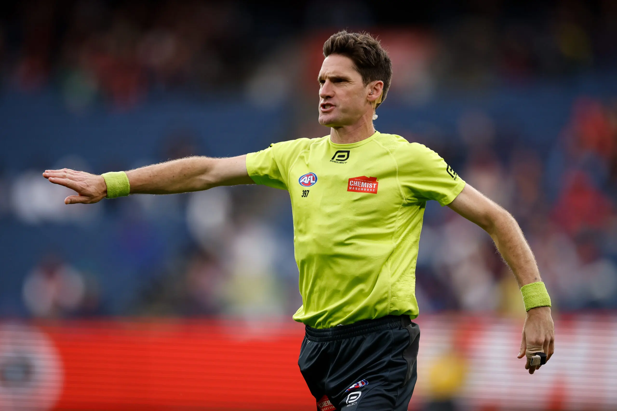 MELBOURNE, AUSTRALIA - MARCH 16: Matt Stevic, AFL Field Umpire in action in his 500th game during the 2025 AFL Round 01 match between the Melbourne Demons and the GWS Giants at the Melbourne Cricket Ground on March 16, 2025 in Melbourne, Australia. (Photo by Dylan Burns/AFL Photos via Getty Images)