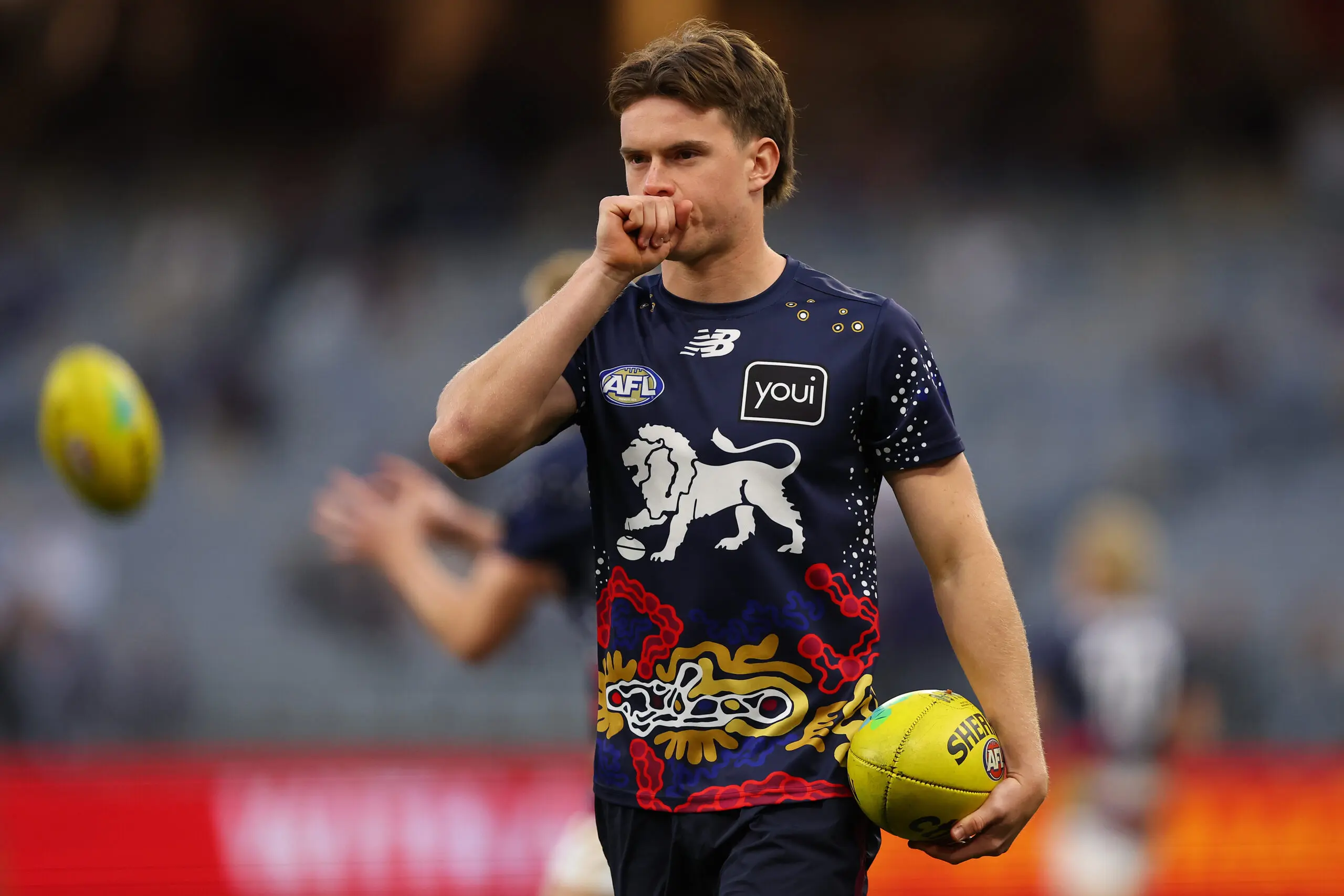 PERTH, AUSTRALIA - AUGUST 15: Sam Marshall of the Lions looks on while warming up during the round 23 AFL match between the Fremantle Dockers and Brisbane Lions at Optus Stadium on August 15, 2025 in Perth, Australia. (Photo by Paul Kane/Getty Images)