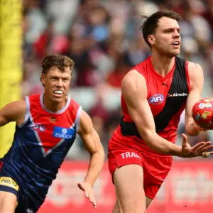 ADELAIDE, AUSTRALIA - APRIL 11: Jordan Ridley of the Bombers handballs during the round five AFL match between Essendon Bombers and Melbourne Demons at Adelaide Oval, on April 11, 2026, in Adelaide, Australia. (Photo by Quinn Rooney/Getty Images)