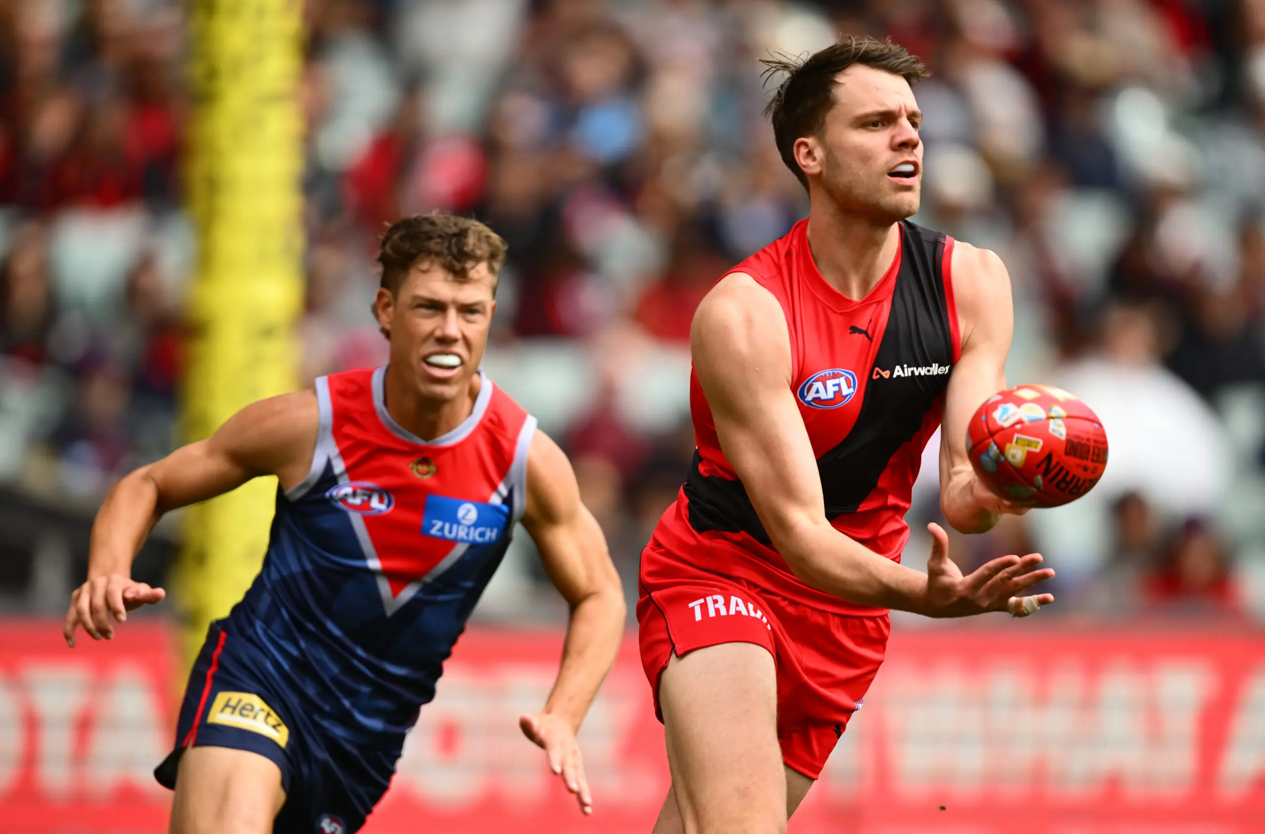 ADELAIDE, AUSTRALIA - APRIL 11: Jordan Ridley of the Bombers handballs during the round five AFL match between Essendon Bombers and Melbourne Demons at Adelaide Oval, on April 11, 2026, in Adelaide, Australia. (Photo by Quinn Rooney/Getty Images)