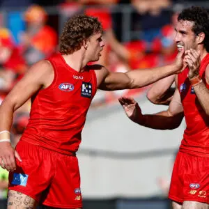 GOLD COAST, AUSTRALIA - APRIL 18: Jed Walter of the Suns celebrates a goal during the 2026 AFL Round 06 match between the Gold Coast Suns and the Essendon Bombers at People First Stadium on April 18, 2026 in the Gold Coast, Australia. (Photo by Russell Freeman/AFL Photos via Getty Images)