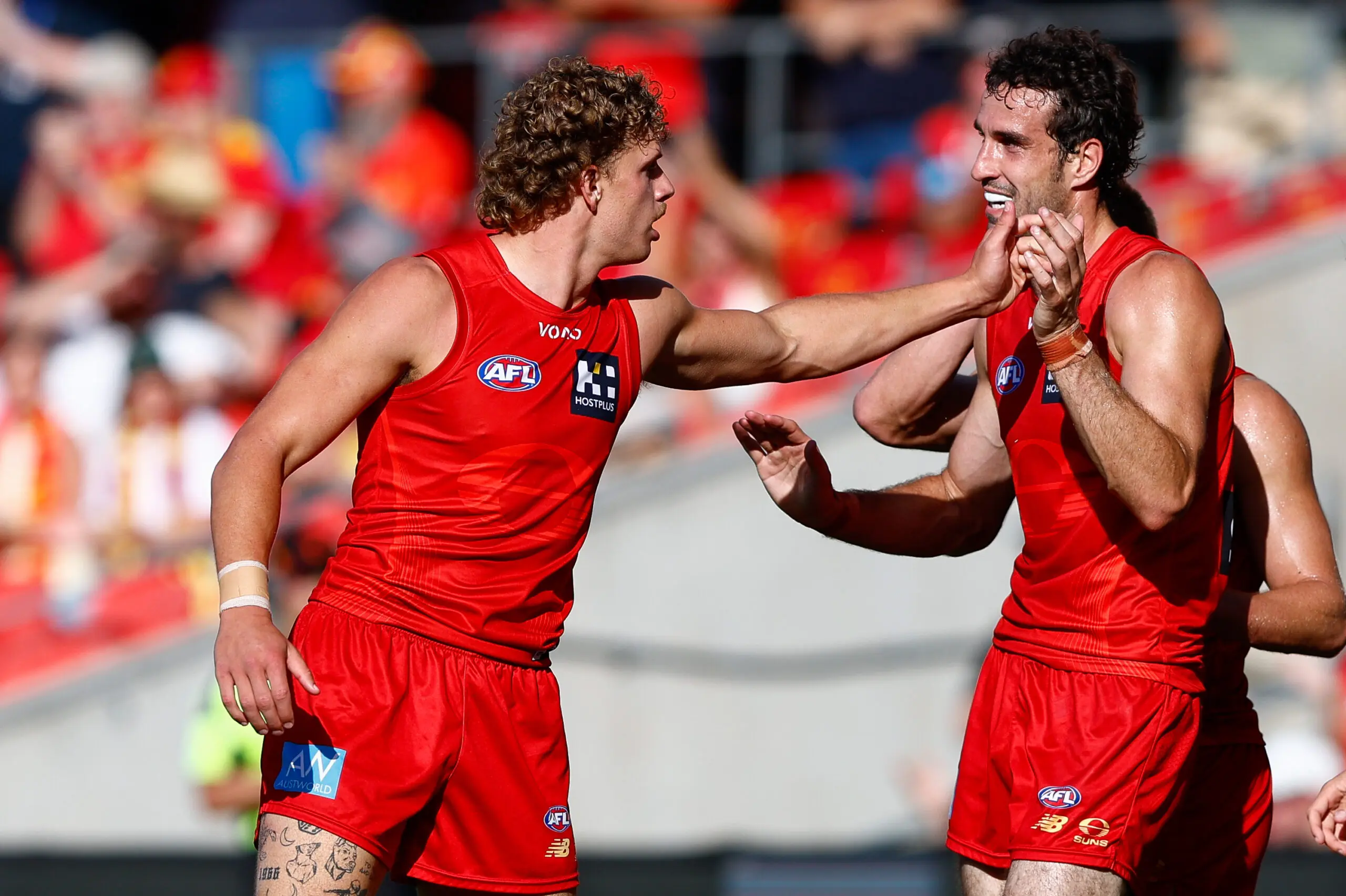 GOLD COAST, AUSTRALIA - APRIL 18: Jed Walter of the Suns celebrates a goal during the 2026 AFL Round 06 match between the Gold Coast Suns and the Essendon Bombers at People First Stadium on April 18, 2026 in the Gold Coast, Australia. (Photo by Russell Freeman/AFL Photos via Getty Images)