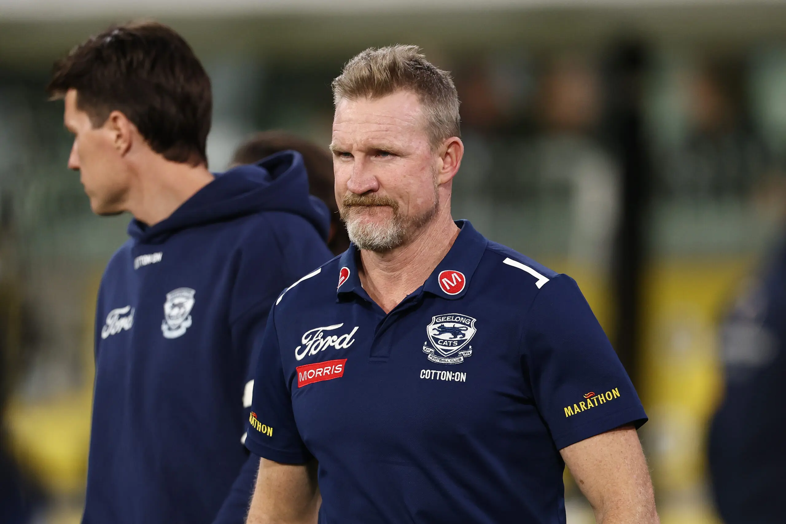 MELBOURNE, AUSTRALIA - MAY 09: Nathan Buckley, assistant coach of the Cats walks to the huddle during the round nine AFL match between Geelong Cats and Collingwood Magpies at Melbourne Cricket Ground, on May 09, 2026, in Melbourne, Australia. (Photo by Morgan Hancock/AFL Photos/via Getty Images)