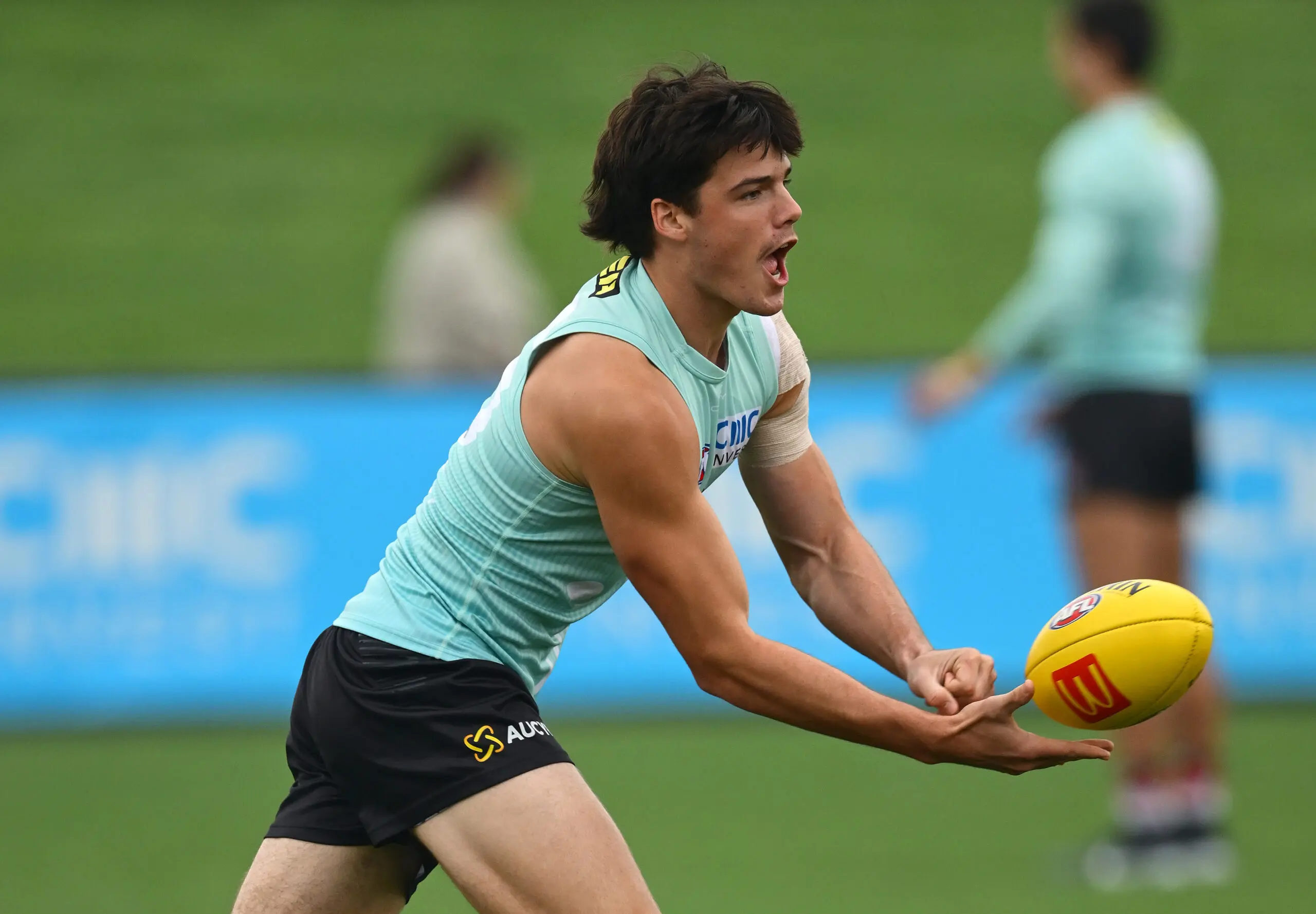 MELBOURNE, AUSTRALIA - MAY 26: Charlie Banfield of the Saints handballs during a St Kilda Saints AFL training session at RSEA Park on May 26, 2026 in Melbourne, Australia. (Photo by Quinn Rooney/Getty Images)