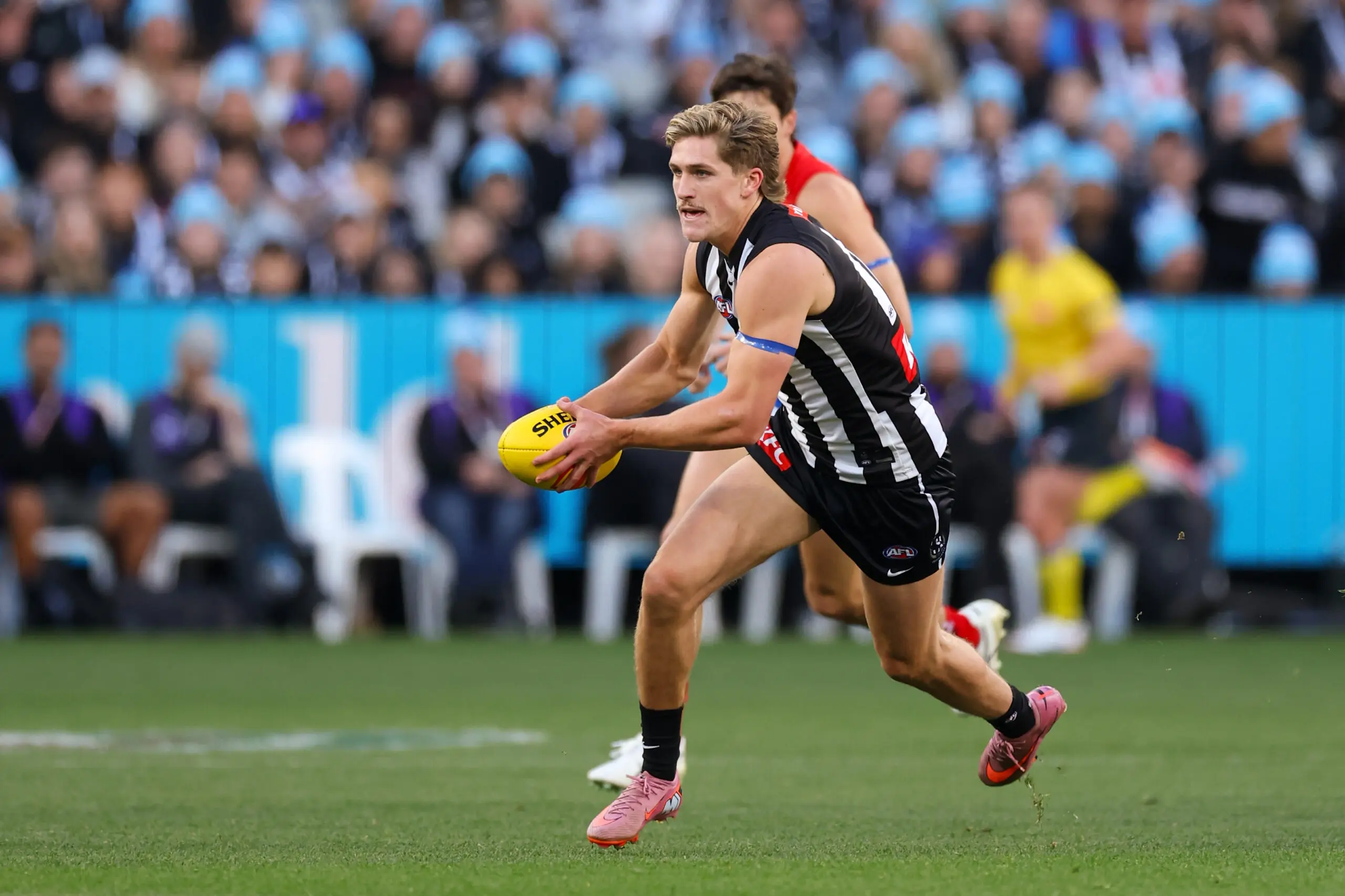 MELBOURNE, AUSTRALIA - JUNE 08: Edward Allan of the Magpies runs the ball during the 2026 AFL Round 13 match between the Collingwood Magpies and the Melbourne Demons at the Melbourne Cricket Ground on June 8, 2026 in Melbourne, Australia. (Photo by Craig Dooley/AFL Photos via Getty Images)