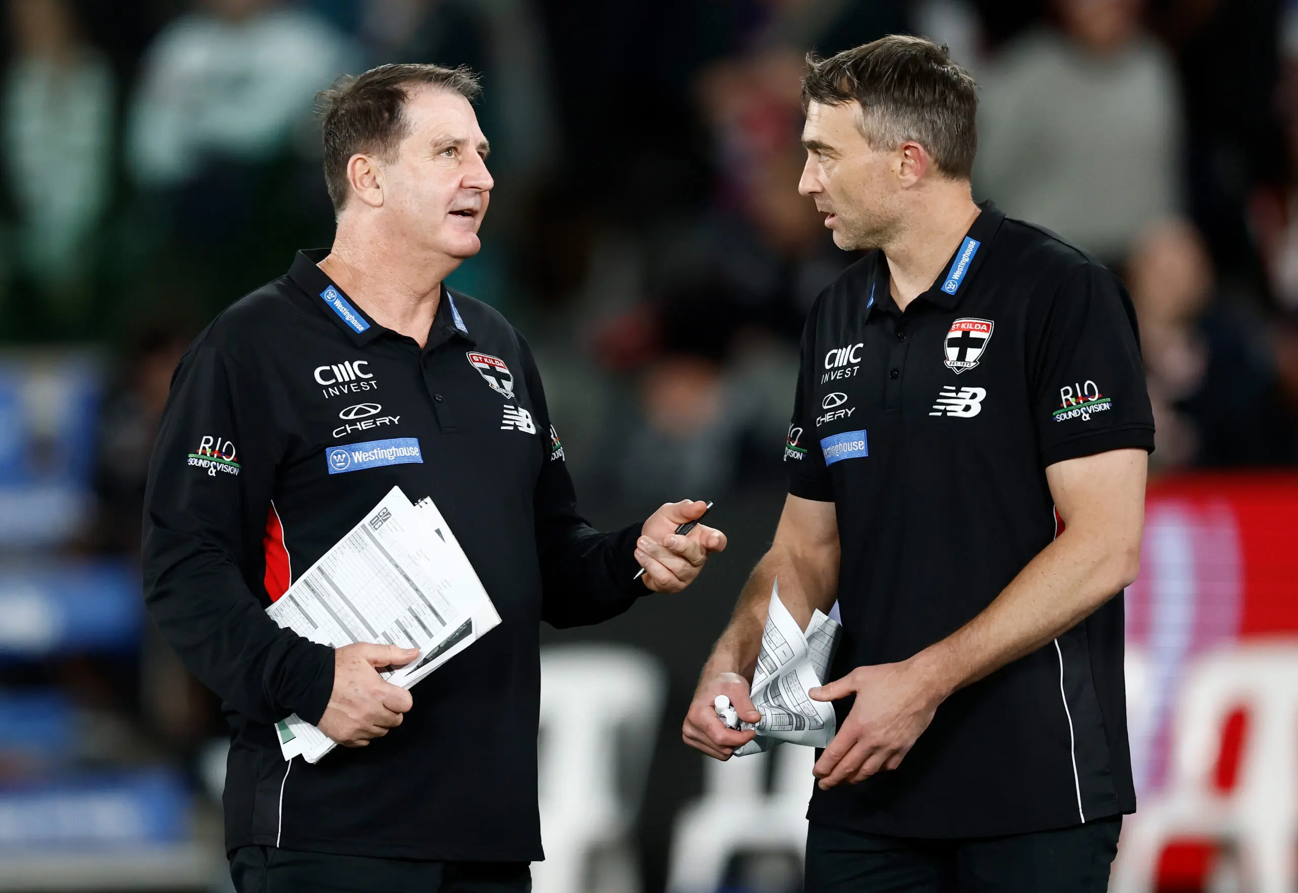 MELBOURNE, AUSTRALIA - JUNE 21: Ross Lyon, Senior Coach of the Saints and Corey Enright, Assistant Coach of the Saints (right) share a discussion during the 2026 AFL Round 15 match between the St Kilda Saints and the Western Bulldogs at Marvel Stadium on June 21, 2026 in Melbourne, Australia. (Photo by Michael Willson/AFL Photos via Getty Images)