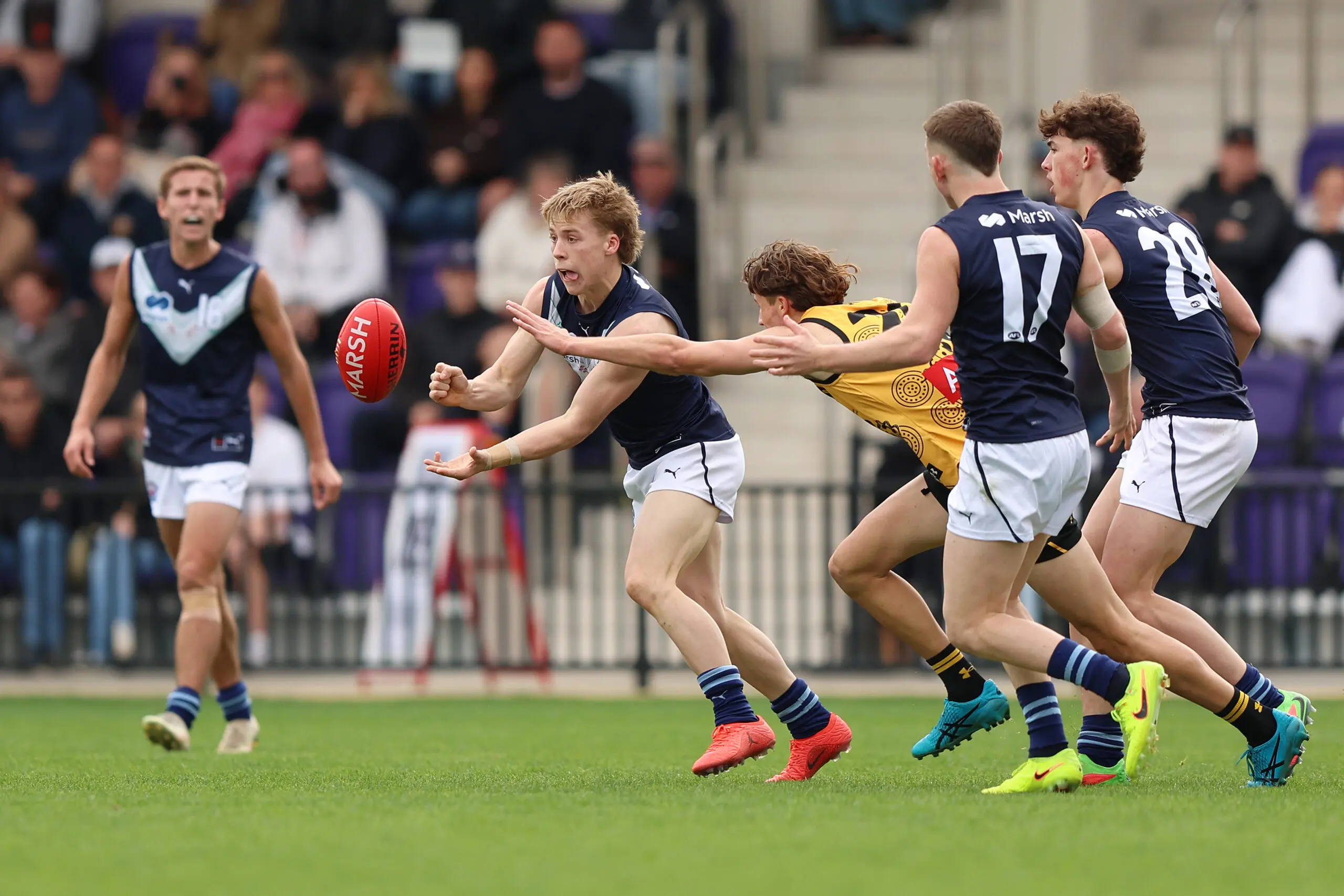 PERTH, AUSTRALIA - JUNE 20: Harvie Cooke of Victoria Metro handpasses the ball during the Marsh AFL National Championships U18 Boys match between Western Australia and Victoria Metro at Cockburn ARC Oval on June 20, 2026 in Perth, Australia. (Photo by Janelle St Pierre/AFL Photos/via Getty Images)