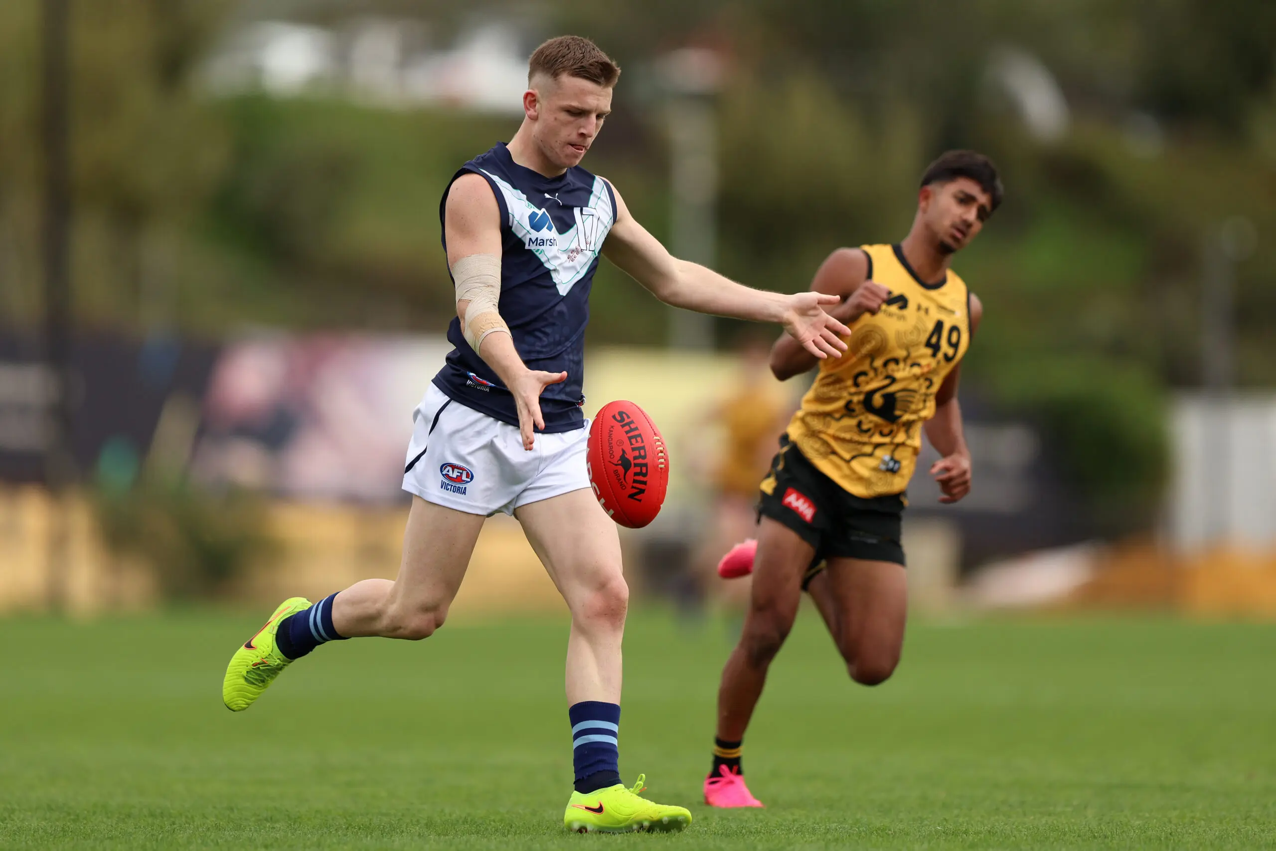 PERTH, AUSTRALIA - JUNE 20: Arki Butler of Victoria Metro kicks the ball during the Marsh AFL National Championships U18 Boys match between Western Australia and Victoria Metro at Cockburn ARC Oval on June 20, 2026 in Perth, Australia. (Photo by Janelle St Pierre/AFL Photos/via Getty Images)