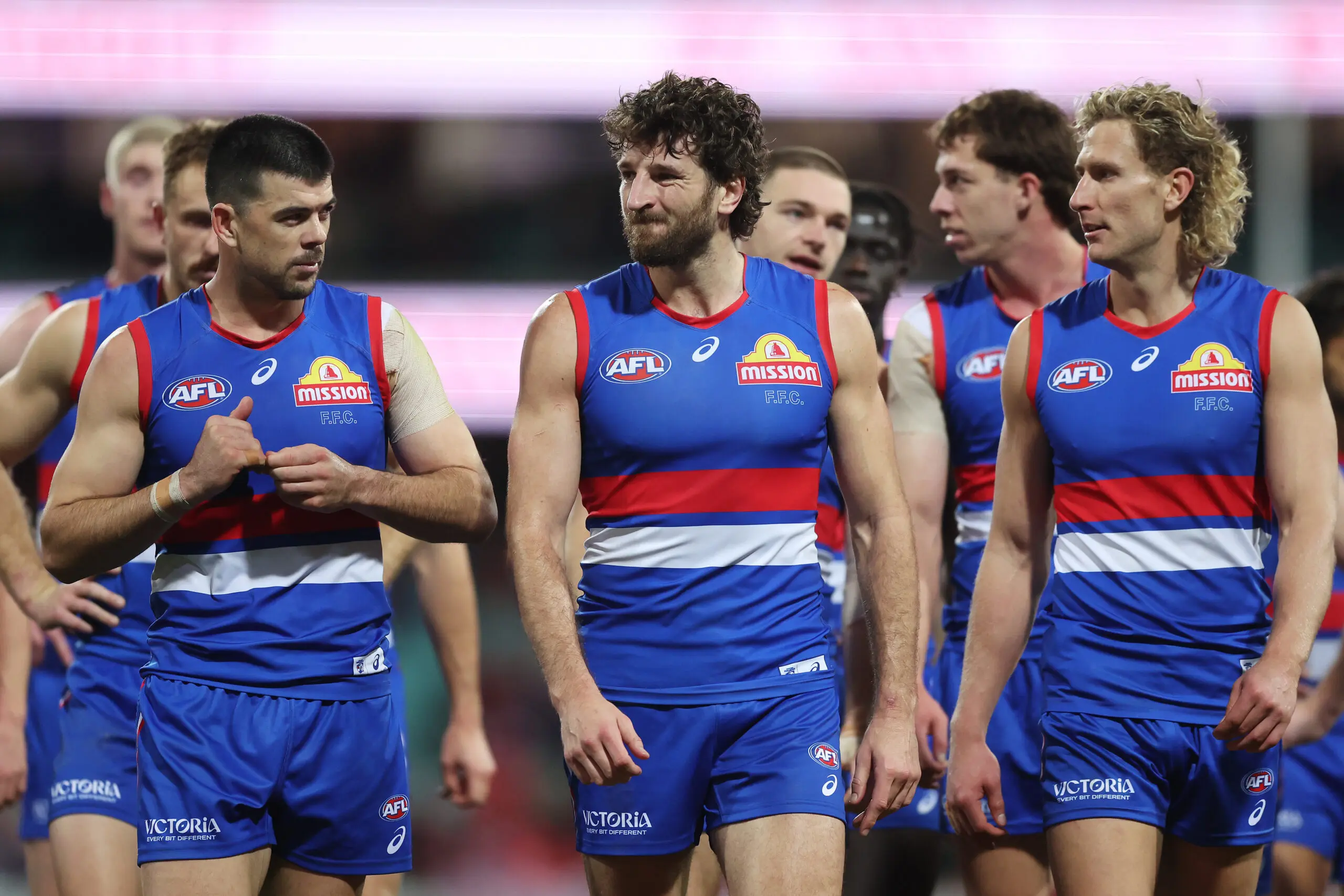 SYDNEY, AUSTRALIA - JULY 03: Bulldogs players look dejected as they walk from the field after defeat during the round 17 AFL match between Sydney Swans and Western Bulldogs at Sydney Cricket Ground, on July 03, 2026, in Sydney, Australia. (Photo by Mark Metcalfe/AFL Photos/via Getty Images)