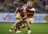 PERTH, AUSTRALIA - JULY 03: Oliver Francou of the Eagles attempts to evade the tackler during the round 17 AFL match between West Coast Eagles and Adelaide Crows at Optus Stadium, on July 03, 2026, in Perth, Australia. (Photo by James Worsfold/Getty Images)