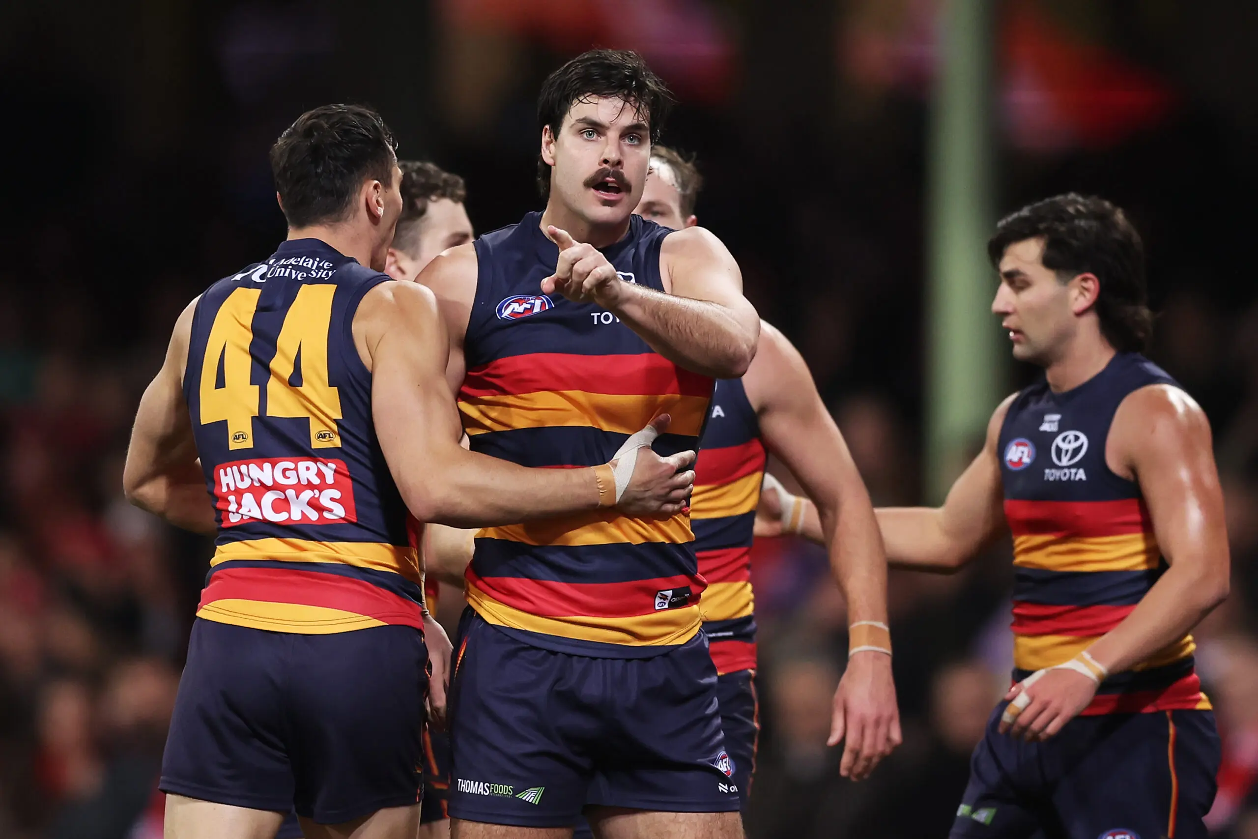 SYDNEY, AUSTRALIA - JULY 17: Darcy Fogarty of the Crows celebrates with team mates after kicking a goal during the round 19 AFL match between Sydney Swans and Adelaide Crows at Sydney Cricket Ground, on July 17, 2026, in Sydney, Australia. (Photo by Matt King/AFL Photos/via Getty Images)