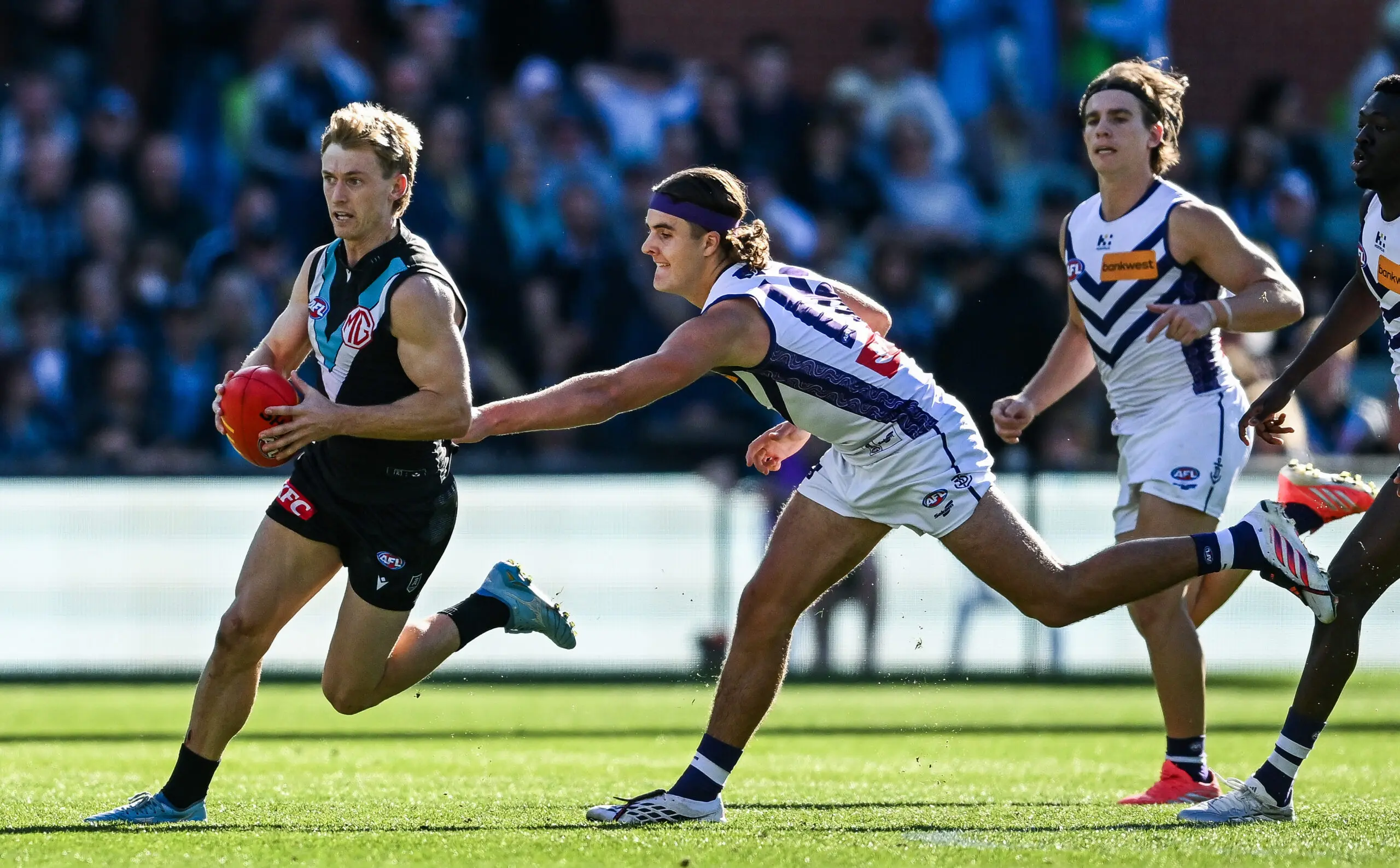 ADELAIDE, AUSTRALIA - JULY 18: Joe Richards of the Power and Murphy Reid of the Dockers during the round 19 AFL match between Port Adelaide Power and Fremantle Dockers at Adelaide Oval, on July 18, 2026, in Adelaide, Australia. (Photo by Mark Brake/Getty Images)