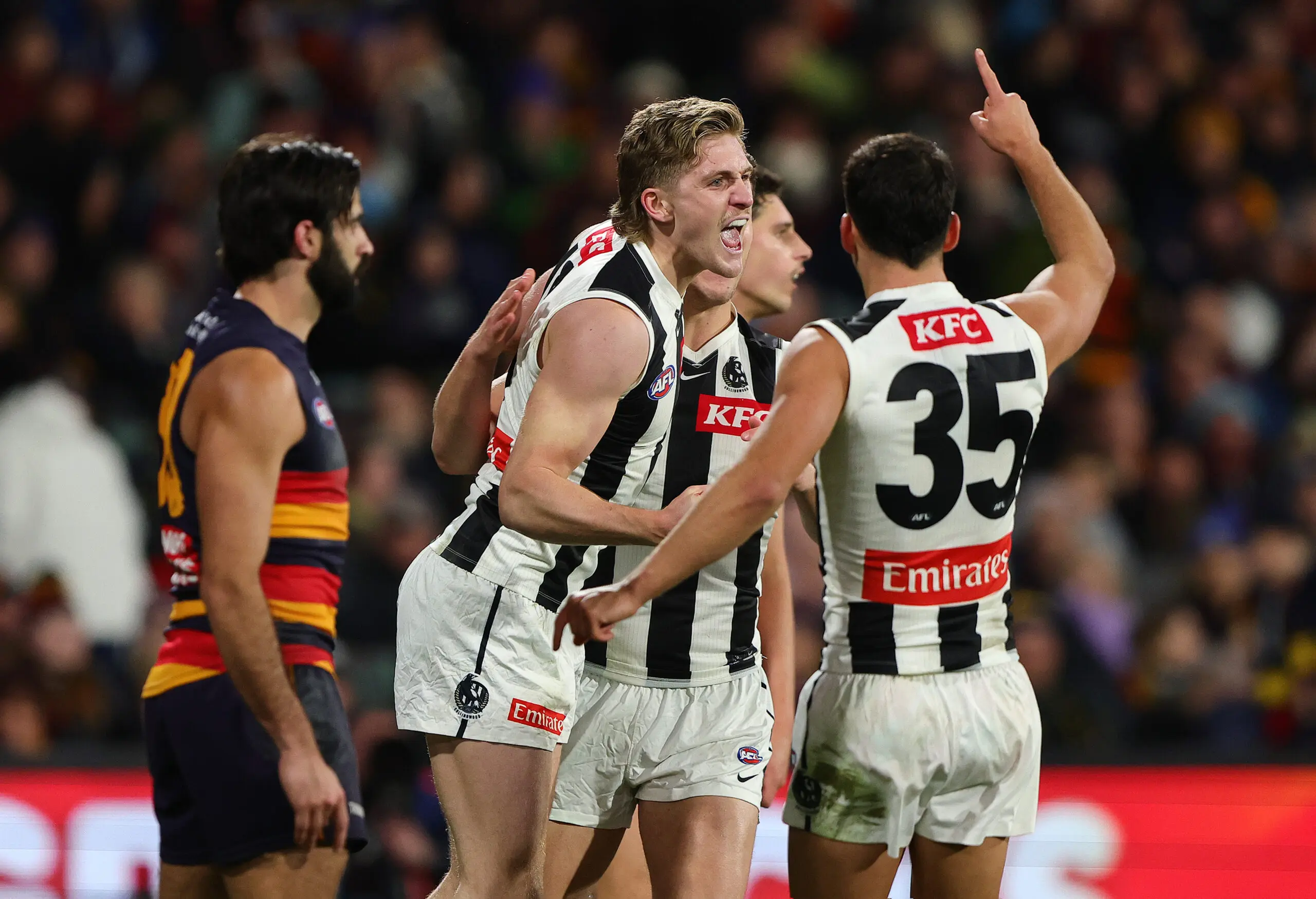 ADELAIDE, AUSTRALIA - JULY 23: Edward Allan of the Magpies celebrates a goal with Nick Daicos of the Magpies during the 2026 AFL Round 20 match between the Adelaide Crows and the Collingwood Magpies at Adelaide Oval on July 23, 2026 in Adelaide, Australia. (Photo by Sarah Reed/AFL Photos via Getty Images)