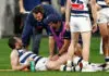 Hampered Geelong champion no certainty for crucial Collingwood clash MELBOURNE, AUSTRALIA - JULY 24: Patrick Dangerfield of the Cats receives treatment on his groin as Chris Scott, Senior Coach of the Cats looks on during the 2026 AFL Round 20 match between the Melbourne Demons and the Geelong Cats at the Melbourne Cricket Ground on July 24, 2026 in Melbourne, Australia. (Photo by Michael Willson/AFL Photos via Getty Images)