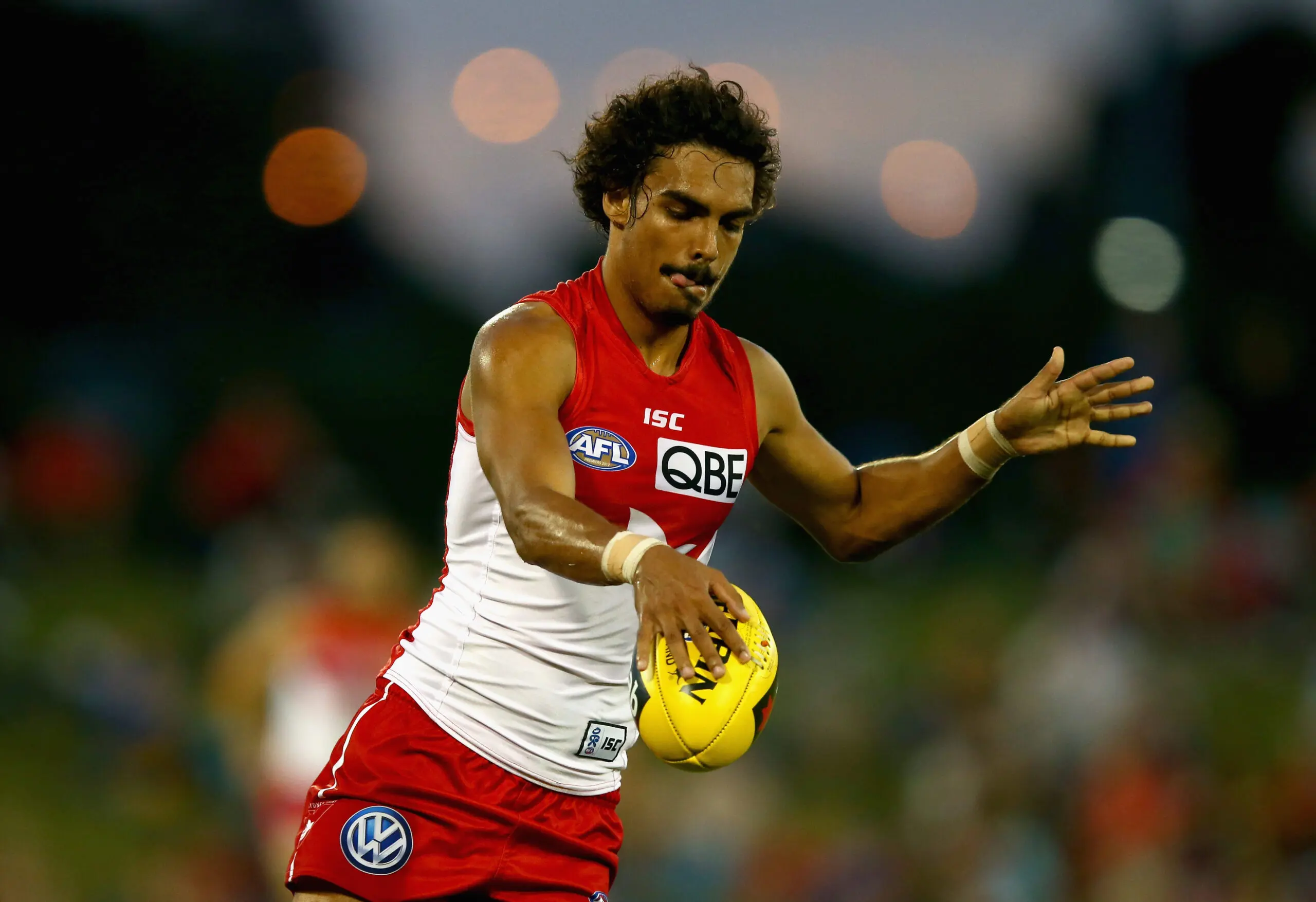 SYDNEY, AUSTRALIA - MARCH 09: Tony Armstrong of the Swans kicks during the round three NAB Cup AFL match between the Sydney Swans and the Gold Coast Suns at Blacktown International Sportspark on March 9, 2013 in Sydney, Australia. (Photo by Ryan Pierse/Getty Images)