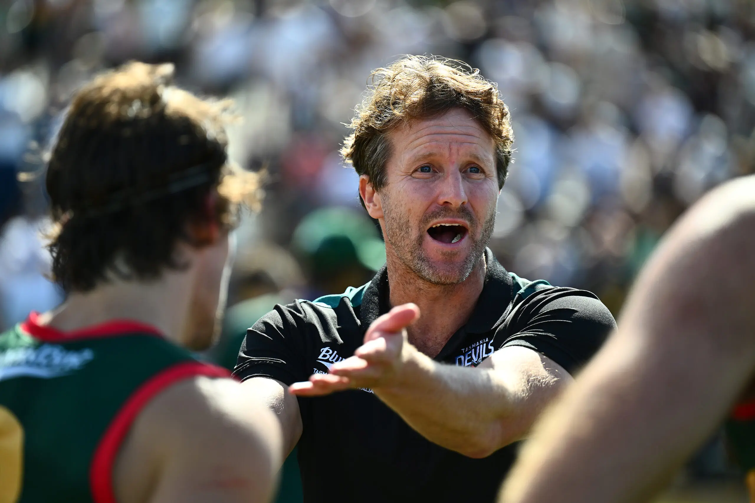 HOBART, AUSTRALIA - MARCH 21: Jeromey Webberley Senior Coach of the Devils addresses the team during the round one VFL match between Tasmania Devils and Coburg Lions at North Hobart Oval on March 21, 2026 in Hobart, Australia. (Photo by Steve Bell/Getty Images)
