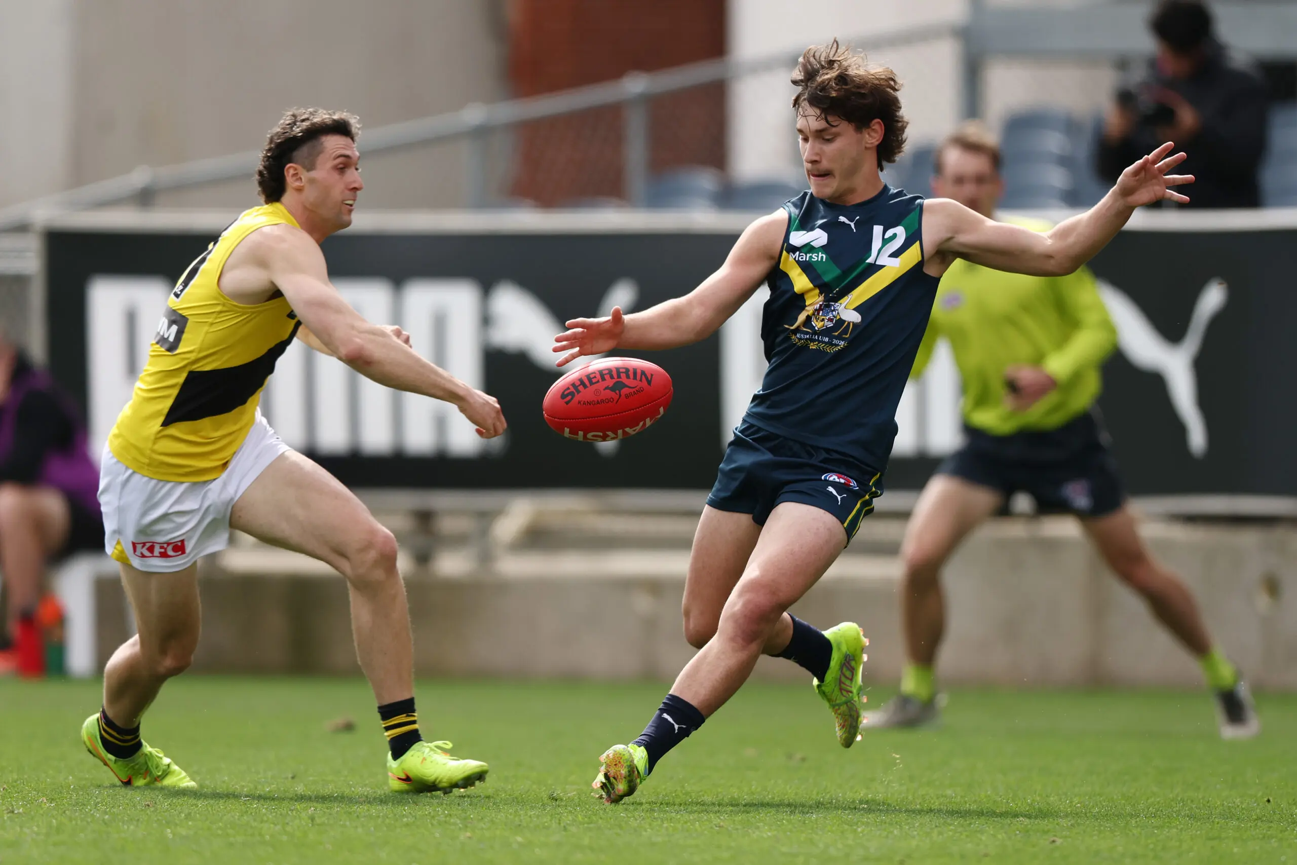 MELBOURNE, AUSTRALIA - APRIL 18: Tanner Armstrong of the AFL National Academy kicks the ball during the Marsh AFL National Academy Boys match between Australia U18 and Richmond VFL at Ikon Park on April 18, 2026 in Melbourne, Australia. (Photo by Morgan Hancock/AFL Photos/via Getty Images)