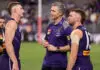 PERTH, AUSTRALIA - APRIL 25: Justin Longmuir, Senior Coach of the Dockers talks to Josh Treacy of the Dockers after their win during the round seven AFL match between Fremantle Dockers and Carlton Blues at Optus Stadium, on April 25, 2026, in Perth, Australia. (Photo by Janelle St Pierre/AFL Photos/via Getty Images)