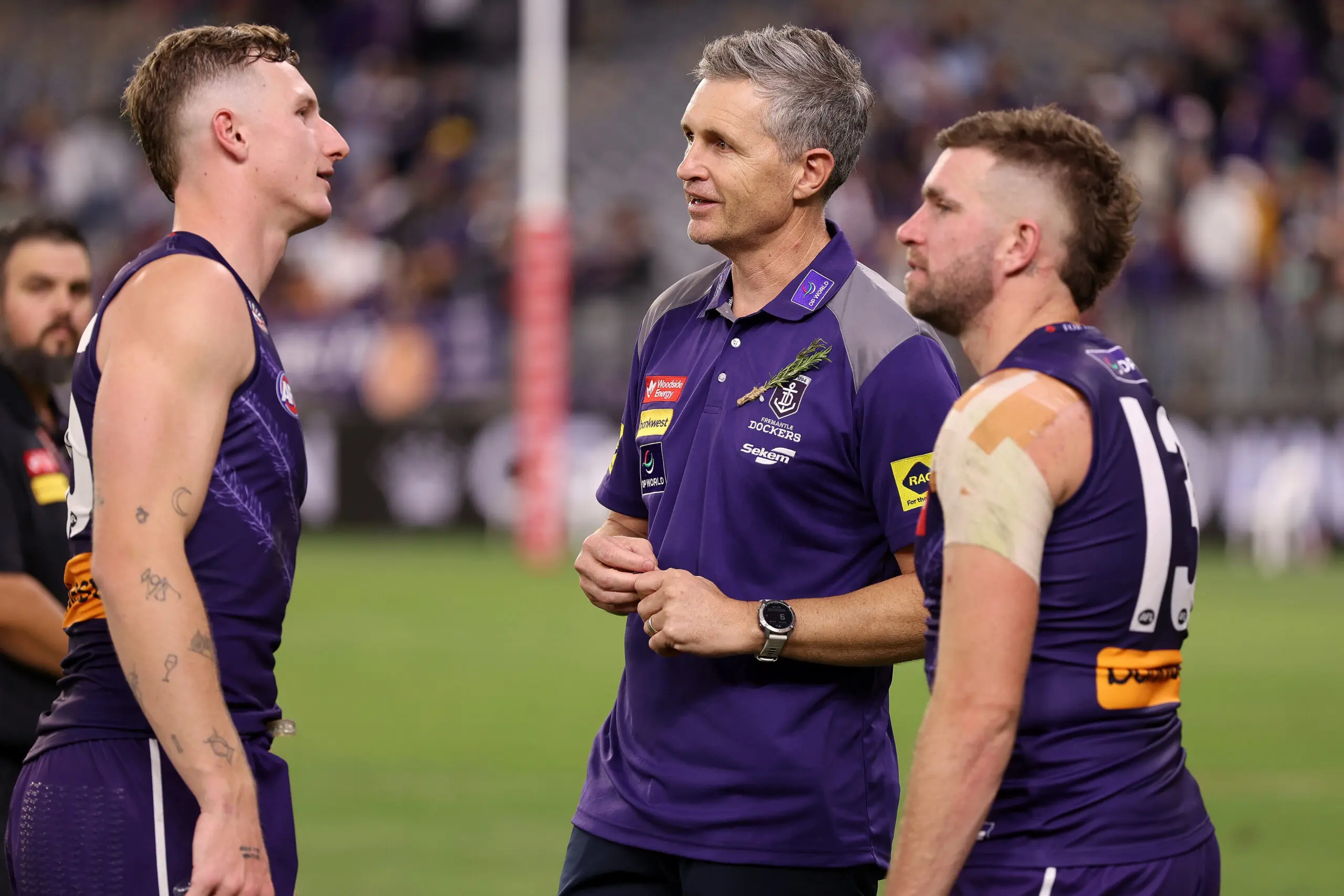 PERTH, AUSTRALIA - APRIL 25: Justin Longmuir, Senior Coach of the Dockers talks to Josh Treacy of the Dockers after their win during the round seven AFL match between Fremantle Dockers and Carlton Blues at Optus Stadium, on April 25, 2026, in Perth, Australia. (Photo by Janelle St Pierre/AFL Photos/via Getty Images)